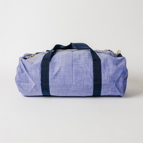 Load image into Gallery viewer, Navy Chambray and Brass Weekend Duffel Bag
