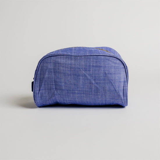Load image into Gallery viewer, Navy Chambray and Brass Traveler Toiletry Bag
